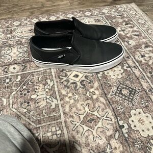 Vans women’s Black and White Slip-On Sneakers